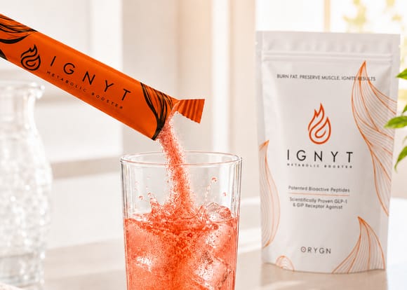 Ignyt metabolic-booster drink stick poured into a glass beside the Ignyt pouch